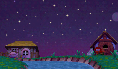 houses at night, witha river flowing next to them