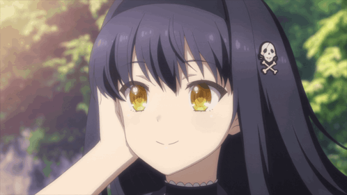 a girl with a skull and crossbones hair clip looking out