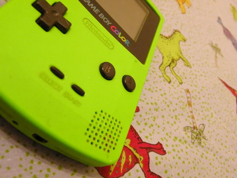 A lime green Game Boy Color handheld console